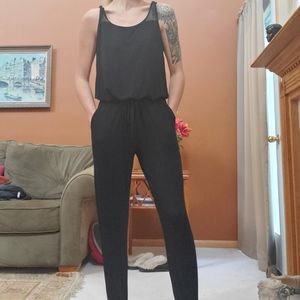 Black Full Body Romper With Fish Net Detail